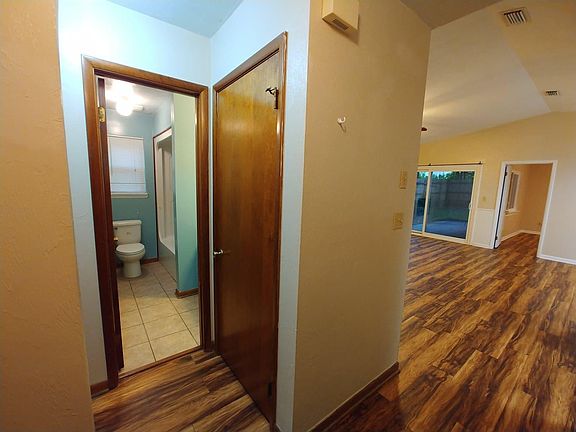 Bathroom, closet, and secondary bedroom hallway.