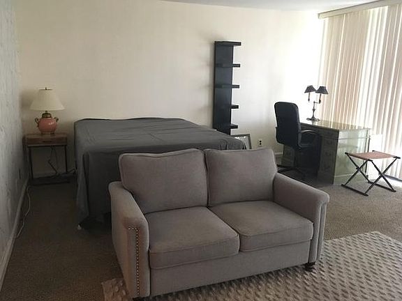 Queen bed, love seat, book case, desk, desk chair, lamps, bedside tables and folding stool included