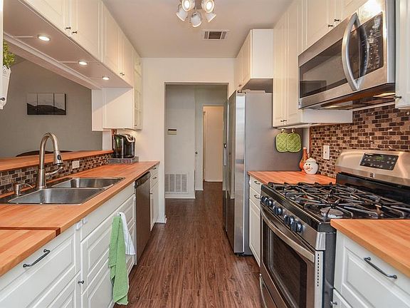 This kitchen is a dream! Fully updated kitchen with all new butcher block countertops, new cabinets, under cabinet lighting, stainless steel appliances, goreous flooring, and the list goes on! This kitchen is one of a kind!