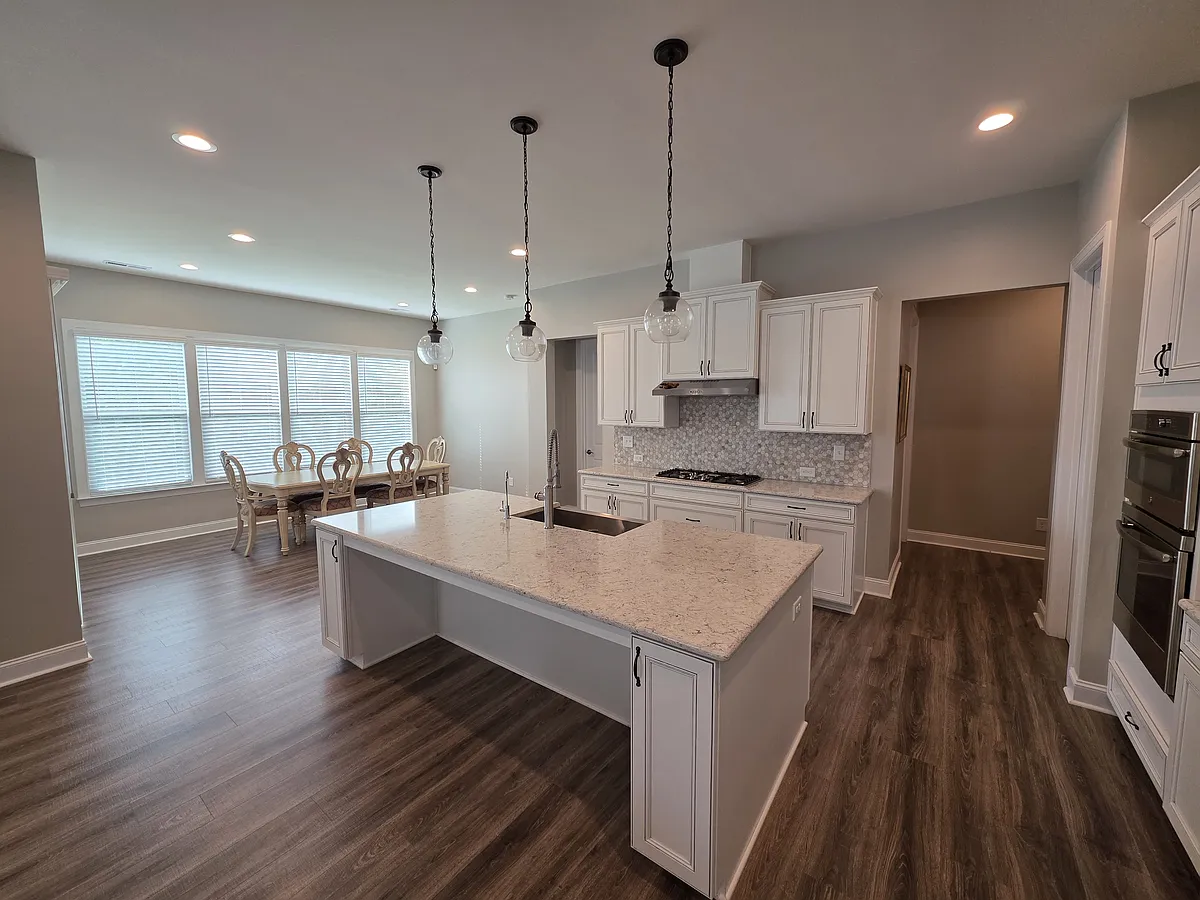 Chef's kitchen with large center island - 14020 Heron Crest Trce