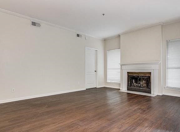 Large Fireplace w/lots of windows in Living area.