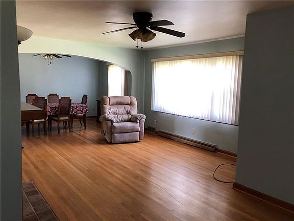 Gorgeous H/W floors have been refinished to perfection and highlight this 16x21 living room with a gas fireplace. The extra wide