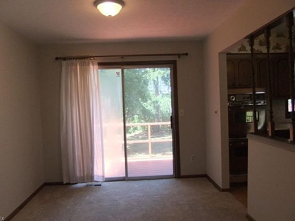 Formal dining room with slider to deck.