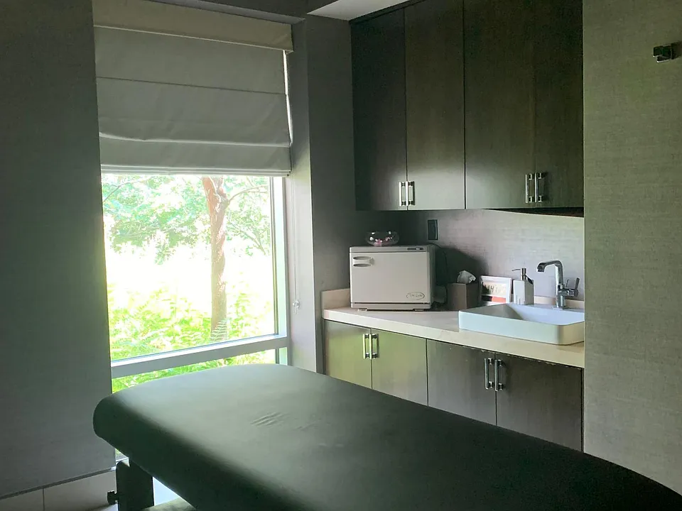 Typical rentable booth setting for body message or facial treatment room. Come with host towel machine, bed, sink and storage cabinet space.