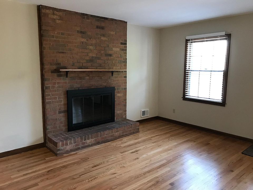 Wood burning fireplace with glass windows and handy mantle. All floors newly refinished. New 2" blinds on this living room window.