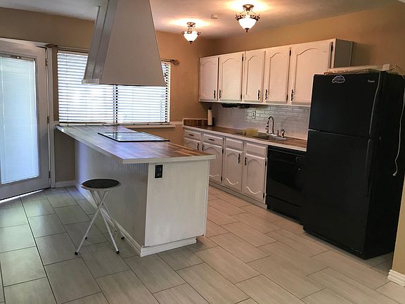 New tiles and freshly painted cabinets for a modern touch