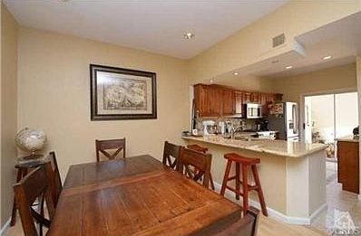 Dining area and breakfast bar offers easy access to kitchen
