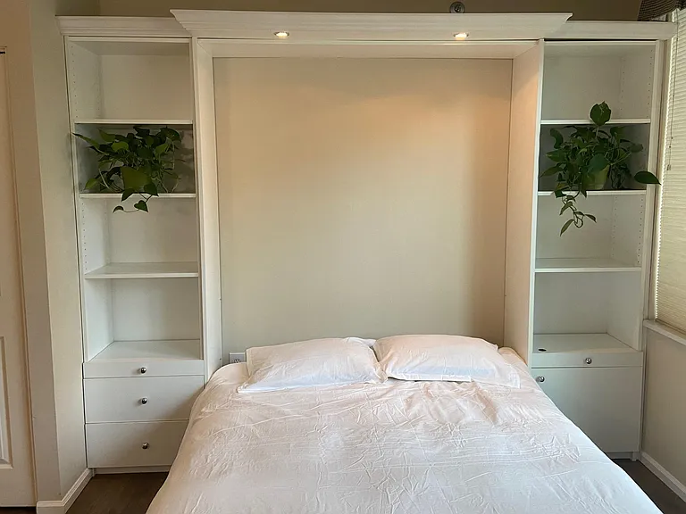 Wall bed with overhead lights for reading