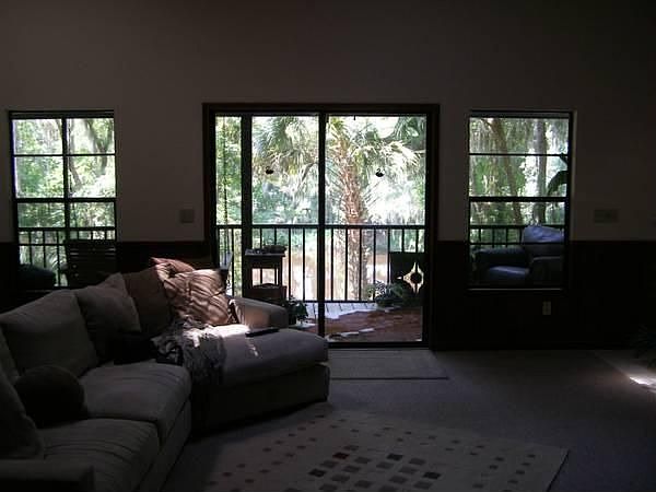 living room with views and screened in lanai