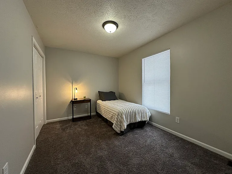(3-Bedroom 1.5 Bath Unit) Back Bedroom - Freshly painted and updated carpet.