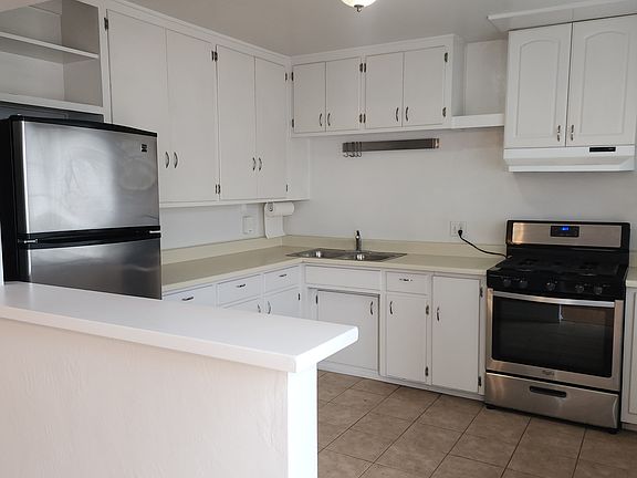 Large kitchen open to living room. 
Portable dishwasher optional - it serves a dual purpose as an additional (portable) cutting board / serving surface.