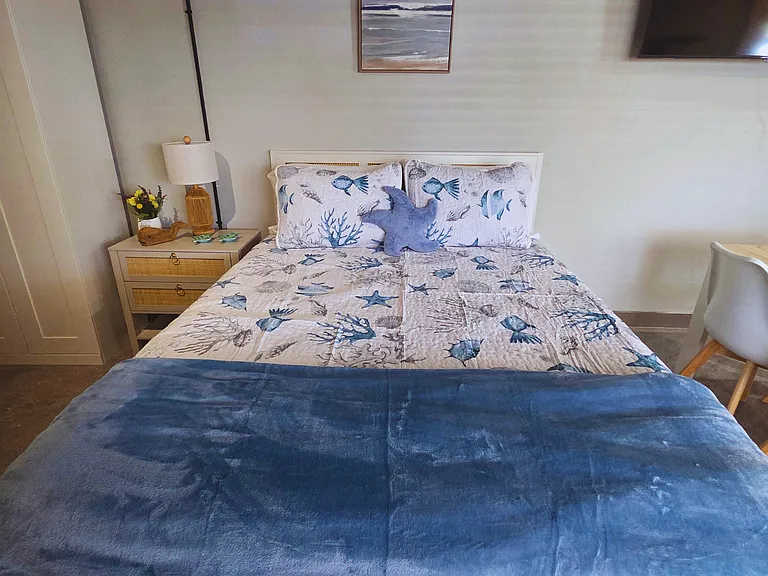 Rest easy with a queen bed, luxe linens, comfy pillows, and spacious closet.