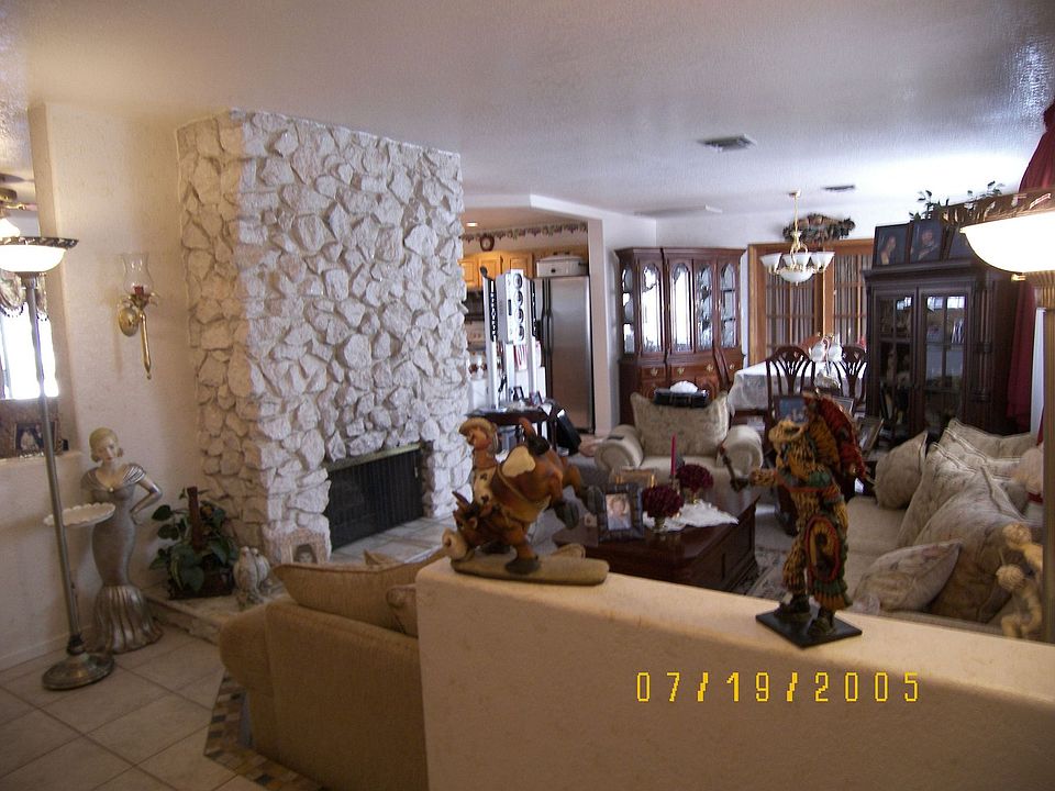 Formal Living room & dinning room with two sided wood burning fireplace