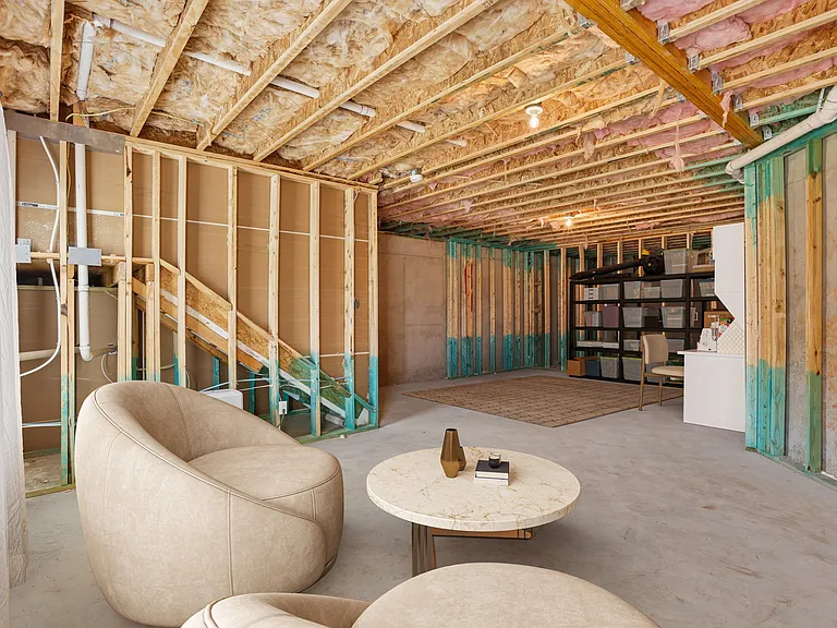 Basement with a comfortable seating area, perfect for relaxation or entertainment.