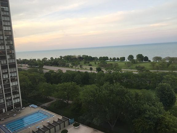 view of lake and park from the living room