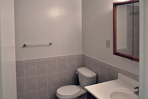 Main Bath with tub. Tile color and size may vary.