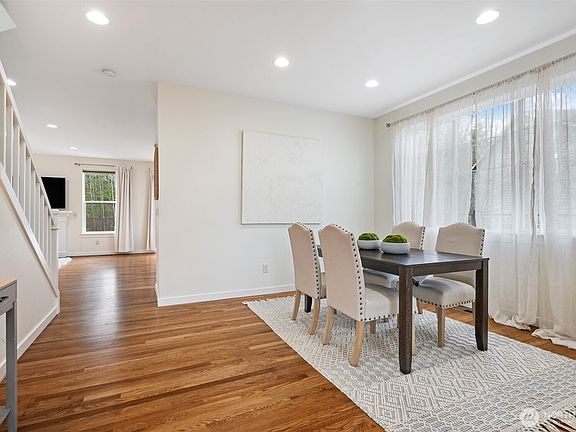 The formal dining room accented with a window can accommodate large or small groups.>