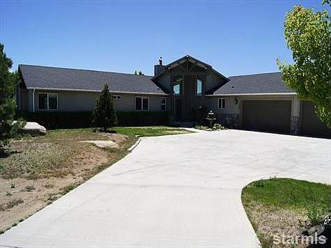 Large cemented driveway leading to 4 car garage and front entry.