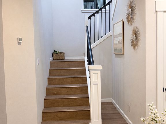 Stairs at the entry of the house (there is a L shaped huge closet on the left side of the stairs)