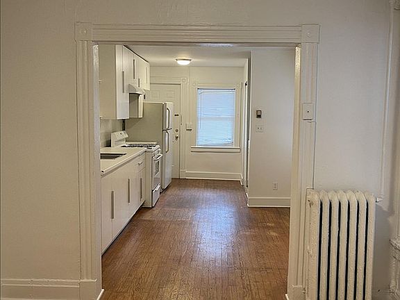 Looking from the living room to the eat-in kitchen