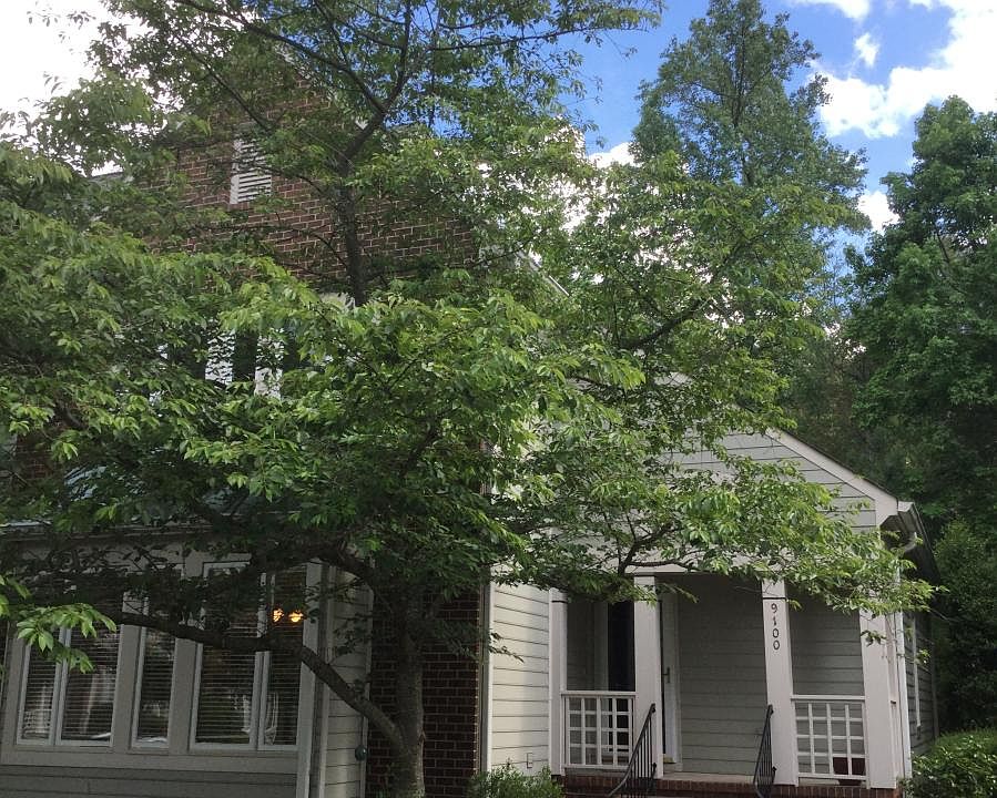 Quiet neighborhood. End unit view of front entrance, porch large enough to accommodate a bench