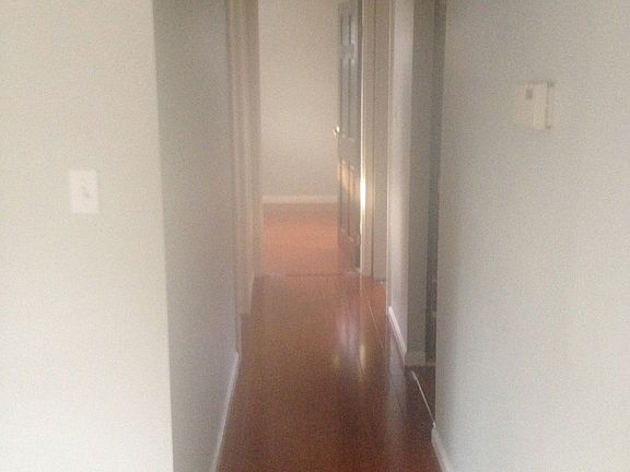 Hallway to 3 bedrooms & bath