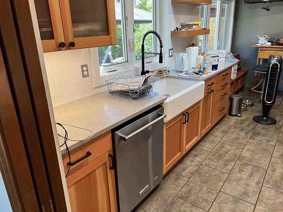 Farmhouse sink with views out to the private backyard