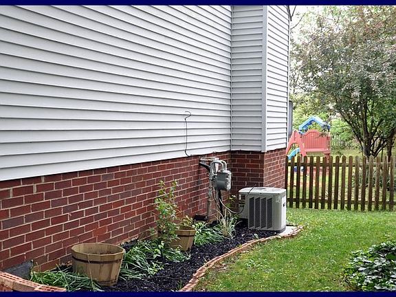 Side view of home & Trane AC (2005)