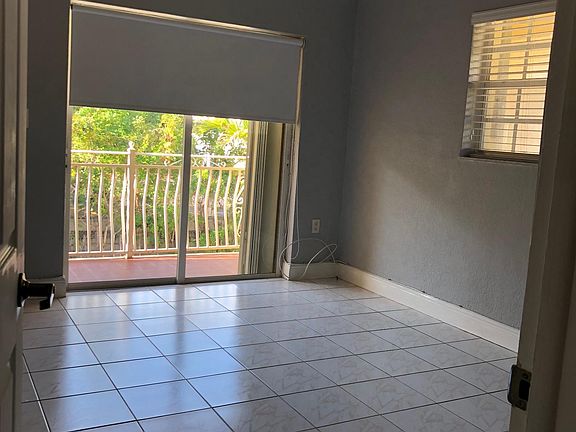 Bedroom with sliding doors and balcony