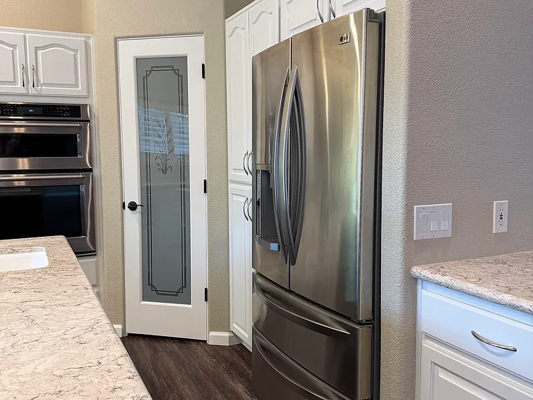 Large kitchen with an easy access pantry