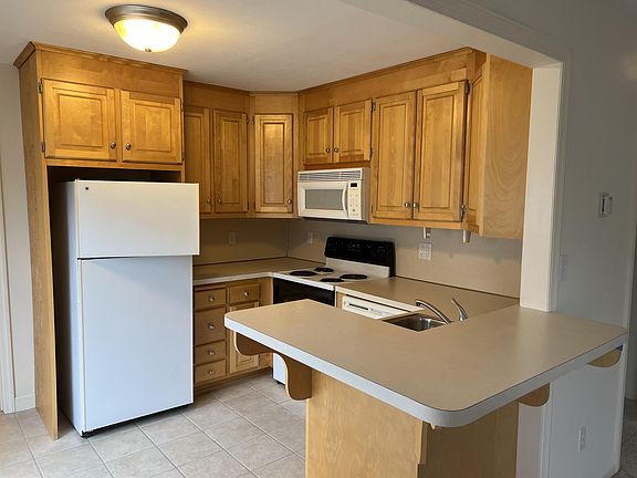 Kitchen- includes Dishwasher/Refrigerator/Range/Microwave/garbage disposal. Small breakfast bar.