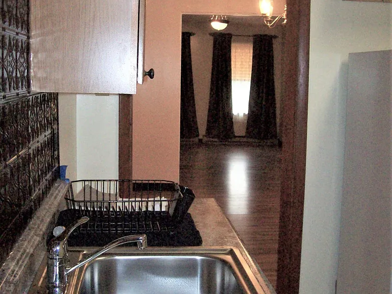 Kitchen view into Dining and Living room