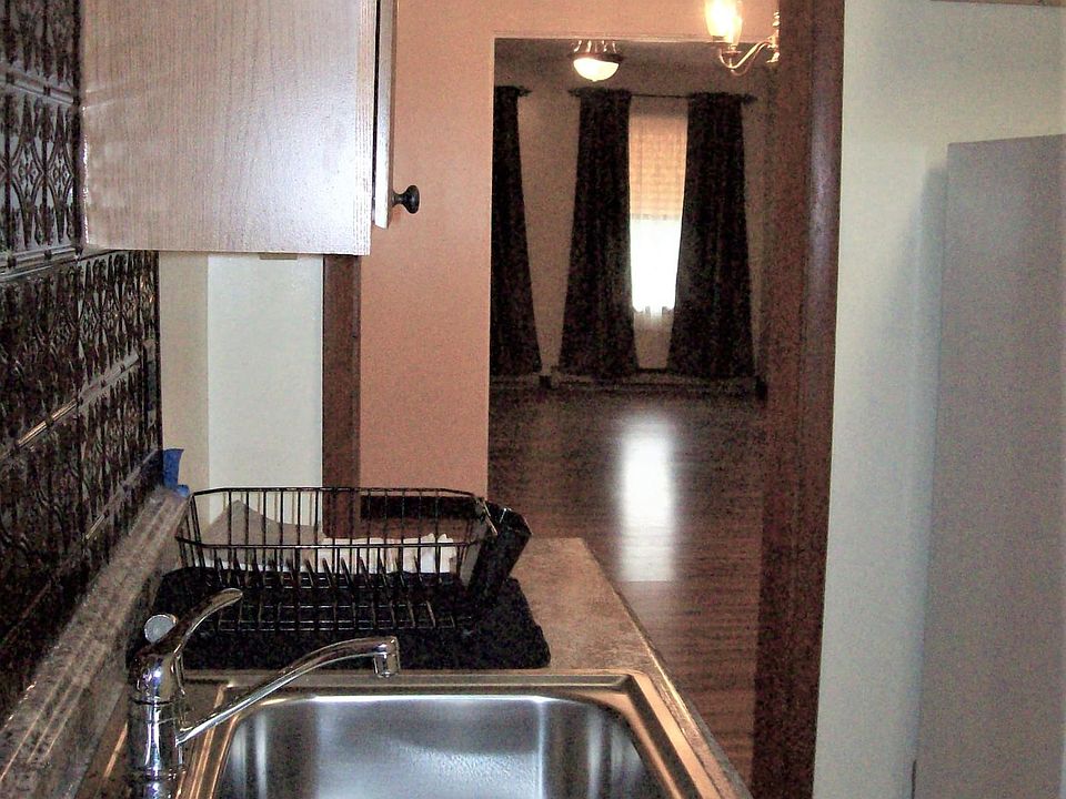 Kitchen view into Dining and Living room
