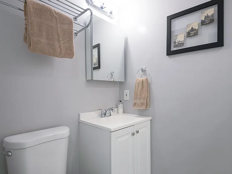 Full bath with shower on entry level of condo.
