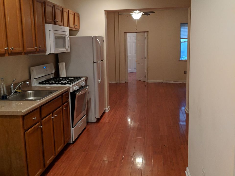 Hardwood floors throughout apartment.