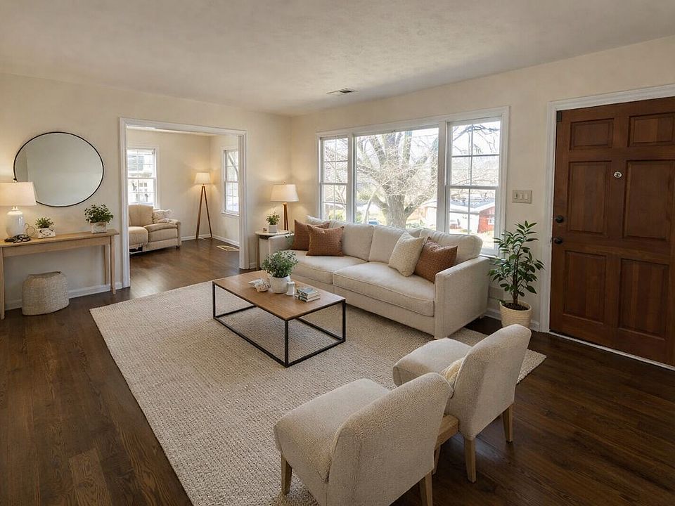 This versatile space can effortlessly serve as a formal living room, with a full-wall apicture window that enhances natural lighting and provides an elegant atmosphere.