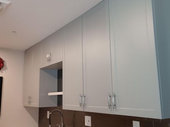Tall kitchen cabinets means lots of storage.