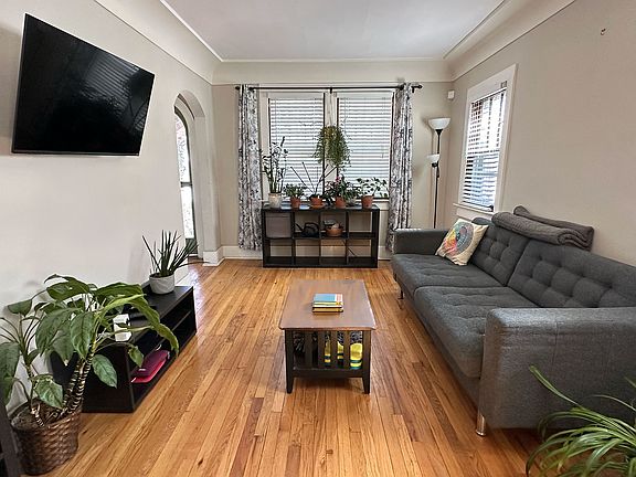 Living room w/hardwoods & lots of natural light