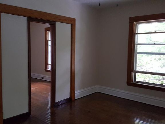 living room showing entrance to front bedroom
