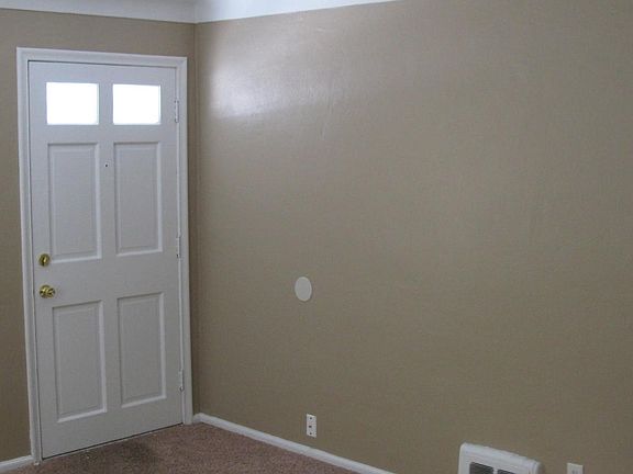 Portion of living room with front door