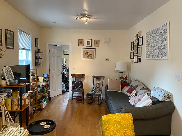 Open concept living area next to kitchen. Hardwood floor. Built-in AC.