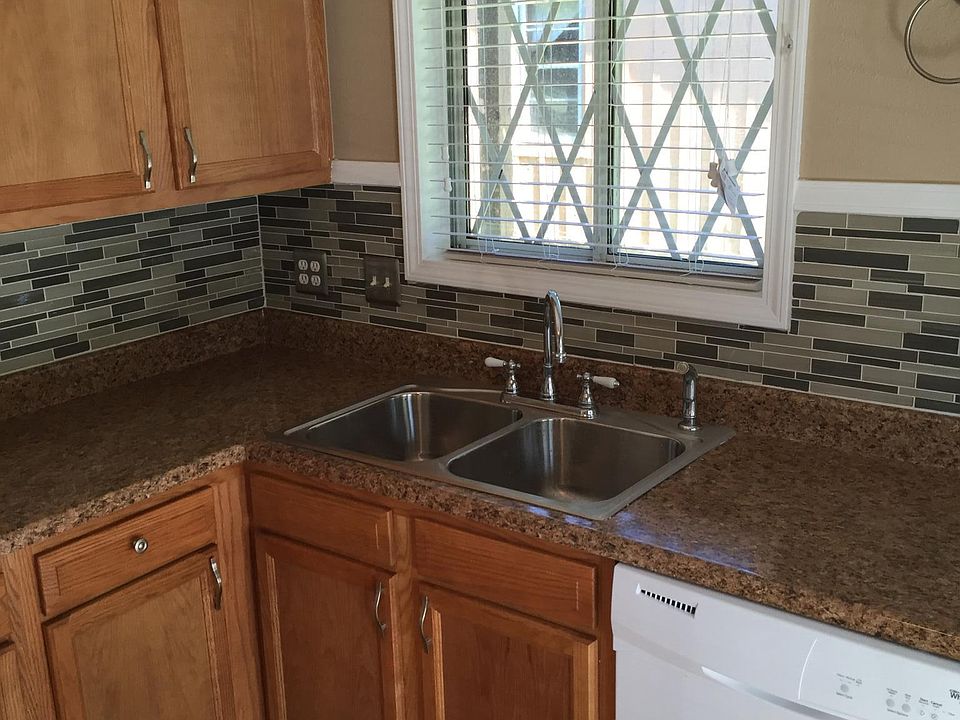 Newer dishwasher, cabinets, sink