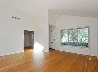 Living room has vaulted ceiling with skylight