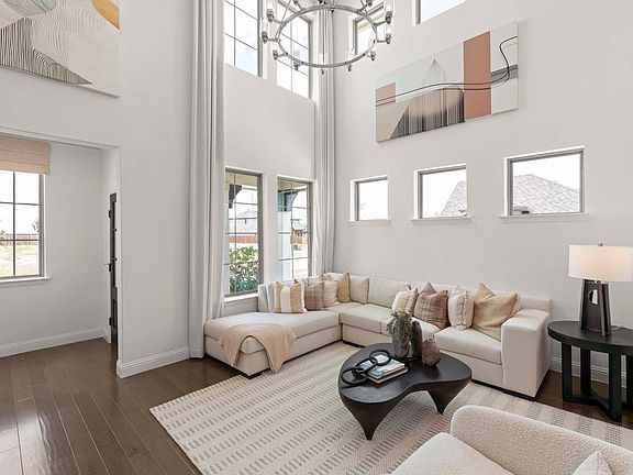Elegant living space showcasing expansive windows, designer finishes, and an open floor plan ideal f
