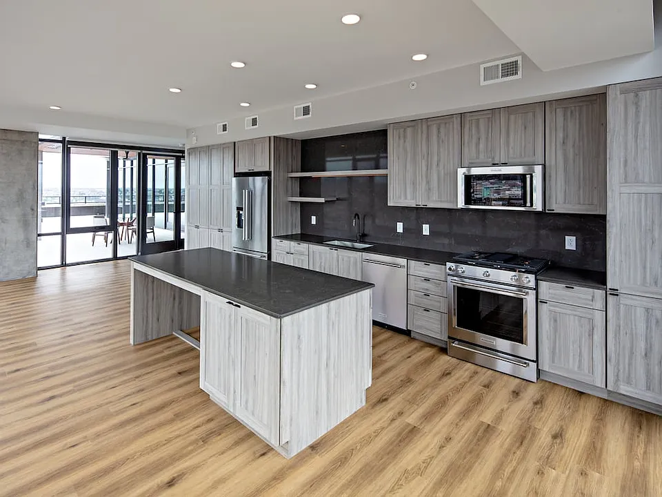 Penthouse-level Signature Collection apartment homes feature kitchens with upgraded finishes and appliances