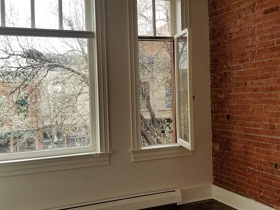 bedroom 2 - exposed brick in both bedrooms and in living room.