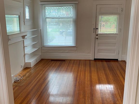Living room with built-in book shelves.