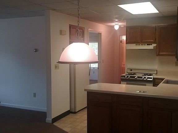 Kitchen, dining, part of living room looking into bedroom.
