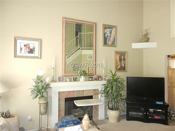 FAMILY ROOM WITH VAULTED CEILING AND FIREPLACE