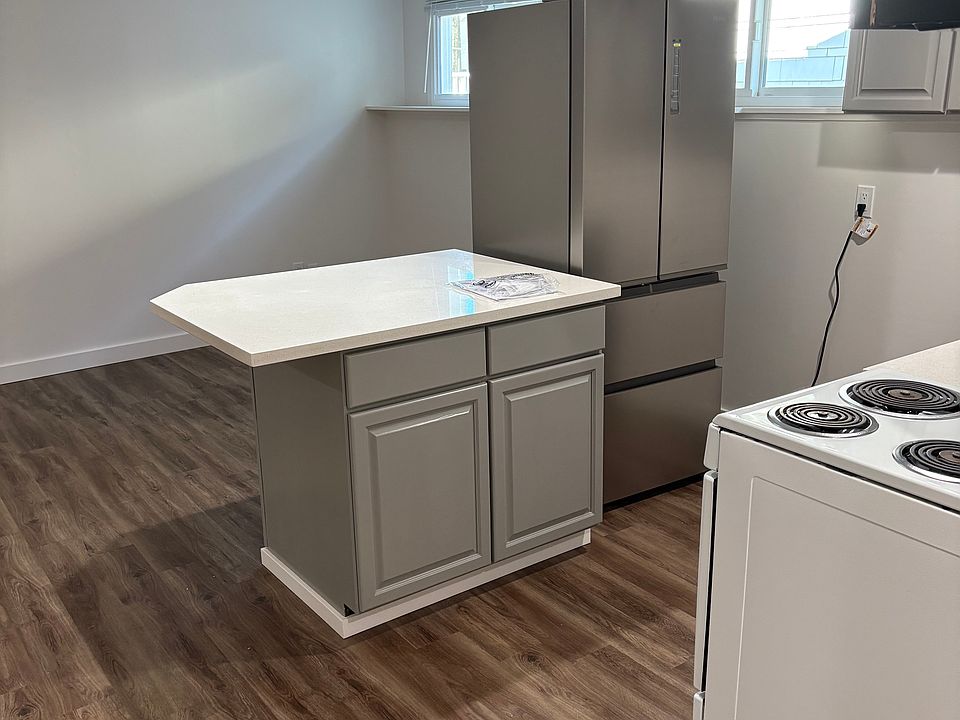 Kitchen with island and new Haier refrigerator